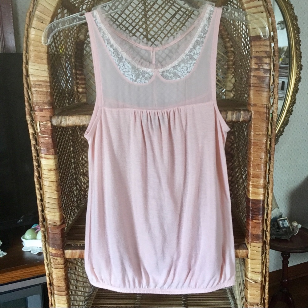 Juniors Dainty Sleeveless Shirt with nape closure.